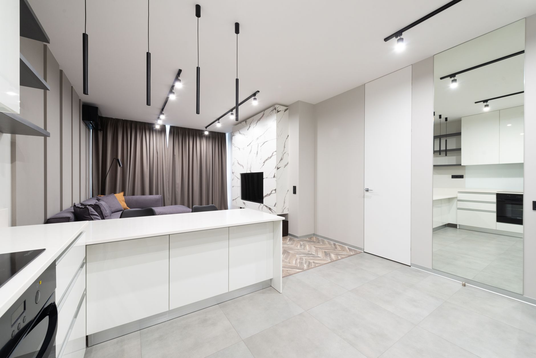 Sleek and modern apartment interior with minimalist design featuring contemporary furniture.