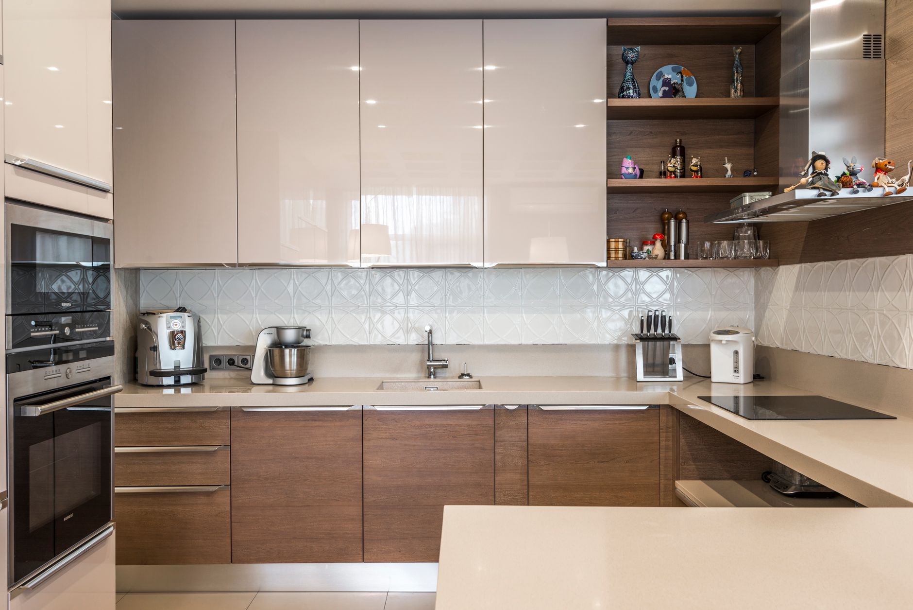 A sleek modern kitchen with contemporary cabinets and high-end appliances.